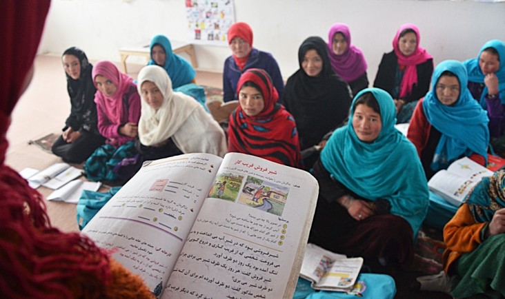 A group of students taking notes in USAID’s Bass